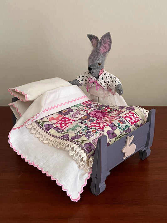 Miss Bun makes her bed